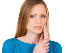 What Is A Root Canal Chicago - A Woman Suffering from Toothache
