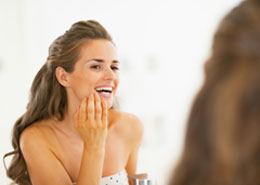 Chicago Tooth Extraction Care - Woman Checkes Her Teeth
