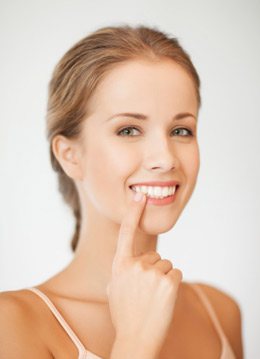 Teeth Whitening Chicago IL - Woman Pointing at her Teeth