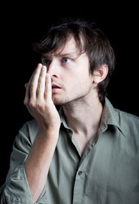Gum Disease Chicago - A Man Checkes His Breath