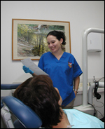 <?php echo $pk; ?> - Friendly big smile dental’s staff with patient