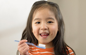 Dentistry For Kids Chicago - Girl with tooth brush