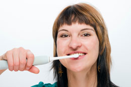 Electric Toothbrush Chicago - A Woman Brushing Her Teeth