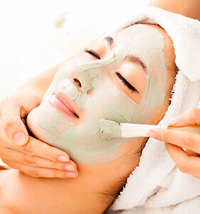A young woman under chemical peels procedure