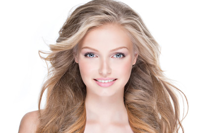Beautiful happy woman with long curly hair