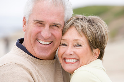 Couple at the beach smiling