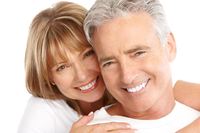 Elderly smiling couple on white background