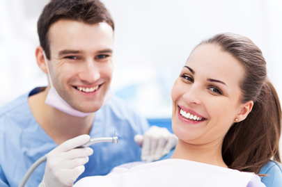 Male dentist and woman in dentist’s office