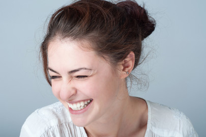 Smiling young woman with brown hair