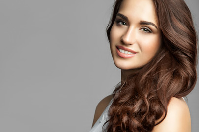 Woman with a long thick curly hair