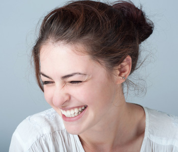 Smiling young woman with brown hair