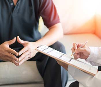 Doctor giving consult for dermatology problems to patient