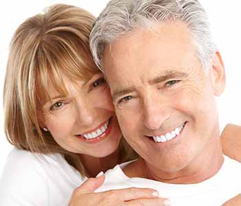 Dentist in Quincy, MA describes treatment options for missing teeth, including full dentures