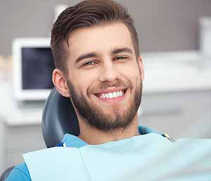 Image of a man ready to use Porcelain Veeners