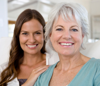 Smiling mother and daughter
