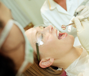 Dentist examining the patient