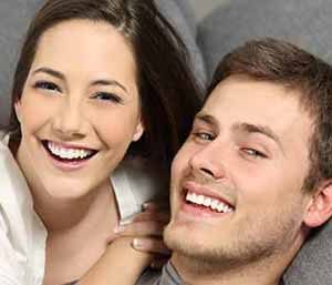 Young couple smilling, with showing their whiter teeth