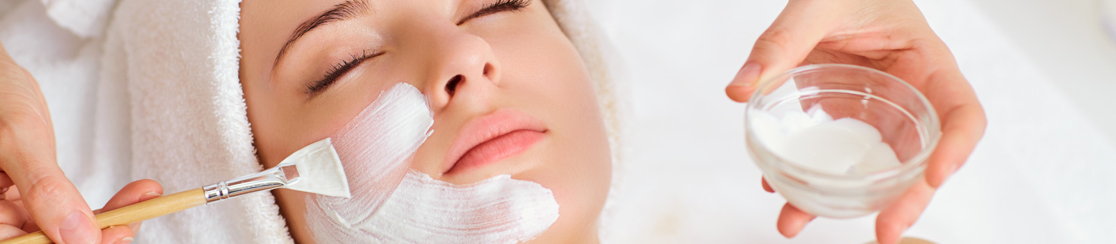 Woman in mask on face in spa