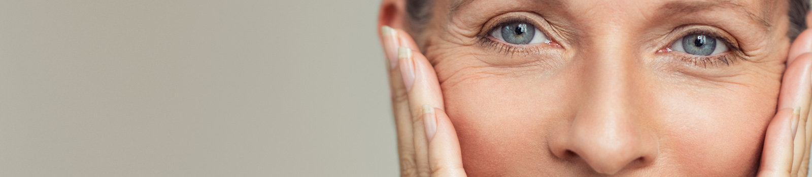 senior woman touching her skin