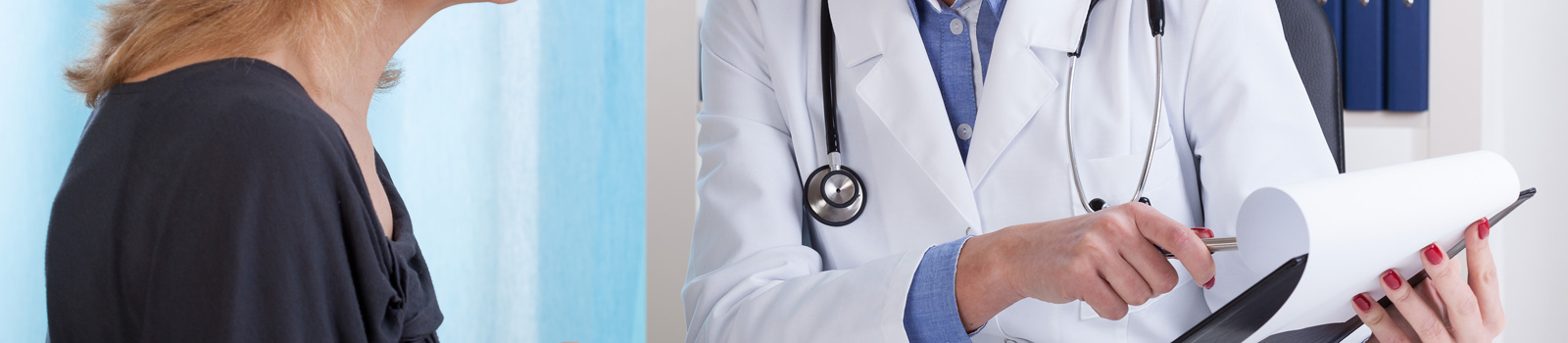 Doctor showing patient test results in office