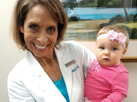 SMILE4OC staff member with kid