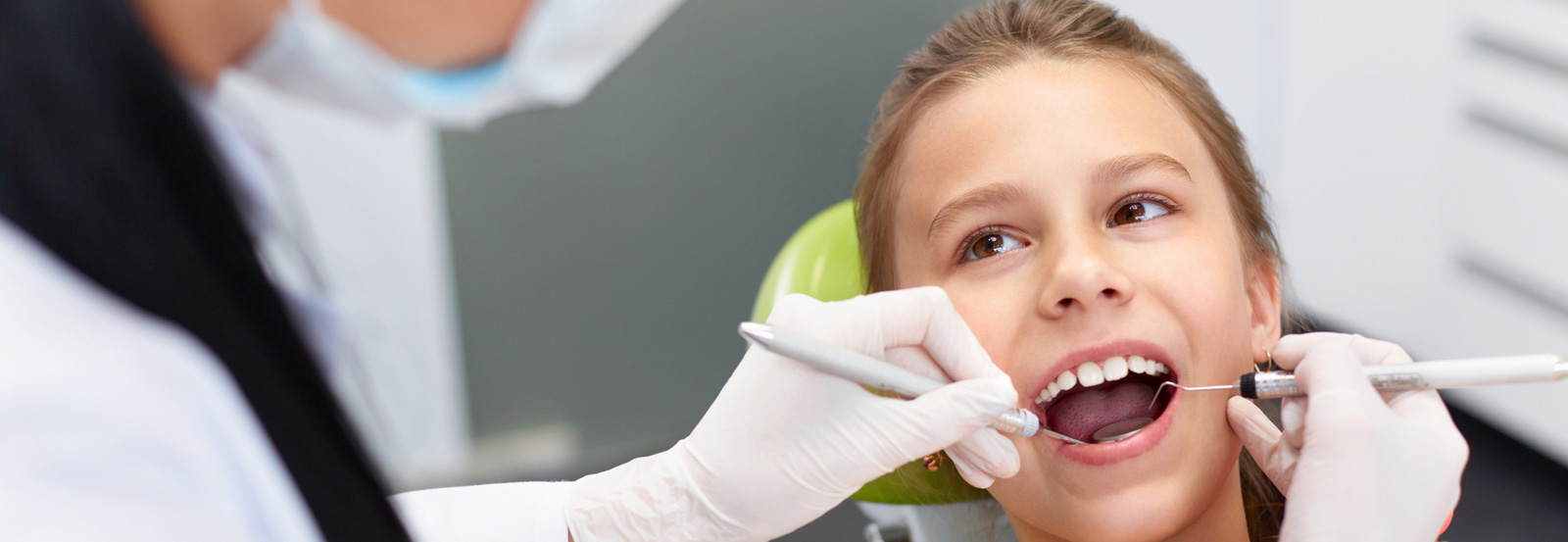 Dentist examining a child mouth