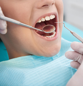 Little patient at dentist office.